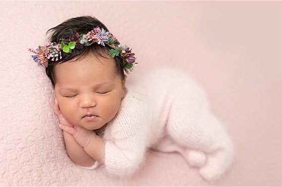 Newborn baby girl in soft pink – Professional newborn photography by Daisy May, Co. Armagh, Northern Ireland.